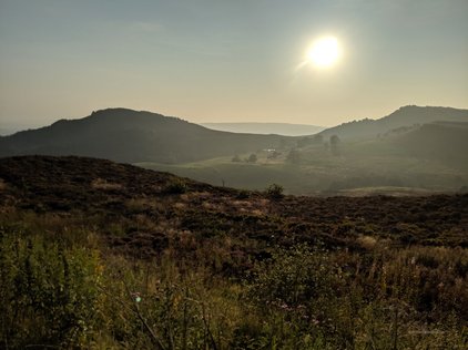 Hazy late afternoon sun over the Roaches