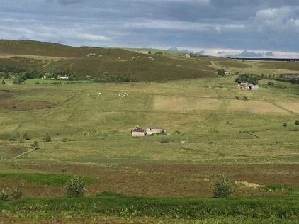 wide view of valley with Shawbottom Farm in the centre of the image