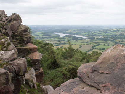 Tittewsworth reservoir glimpsed between rocks at Hen Cloud